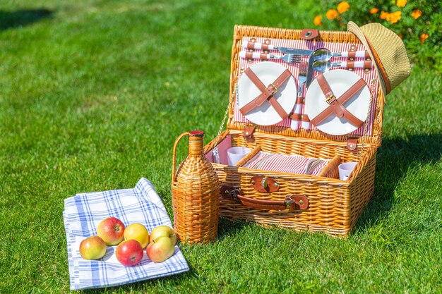 Various fruits in basket on field