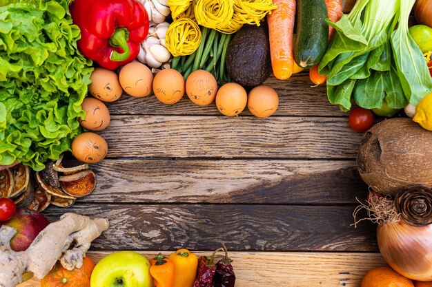 Photo various fruits on multi colored vegetables