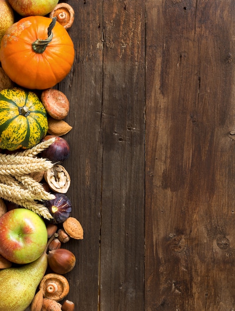 Various fruits and nuts on a wooden table