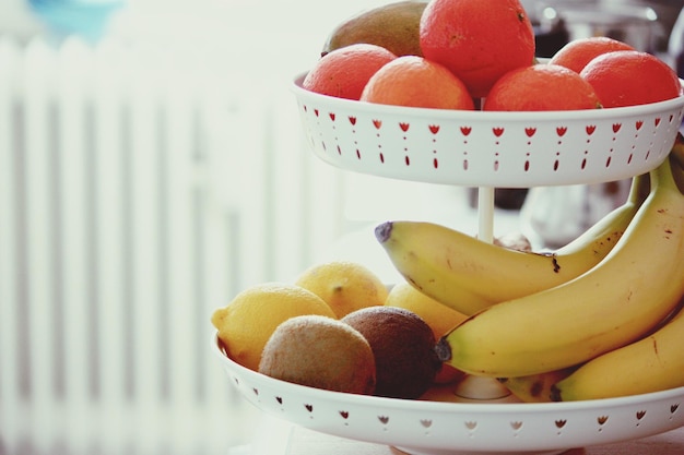 Various fruits in shelf at kitchen