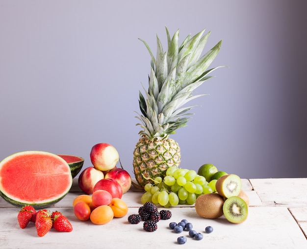 Various fruits on the white wooden table