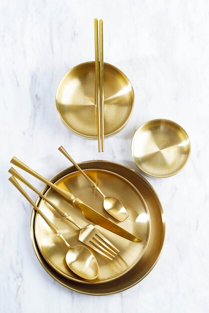 Various Gold Plate Bowl Spoon and Fork on White Table Food Photography Props