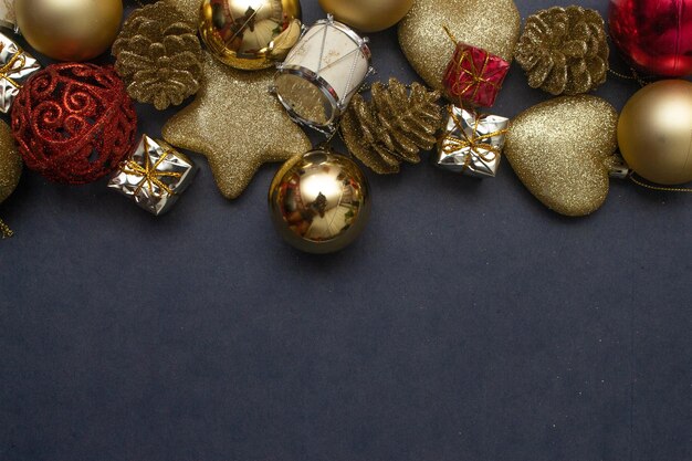 Various golden christmas ornaments on blue background