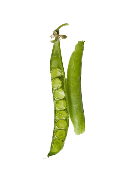 Various green vegetables on a light background, top view