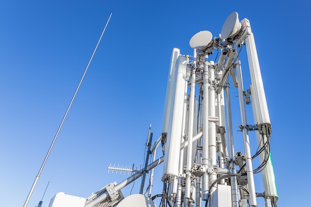 Various GSM antennas against the blue sky