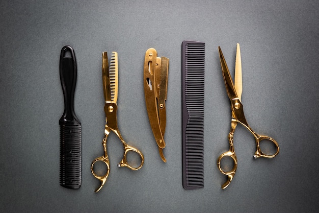 Various hair dresser and cut tools on black background with copy space