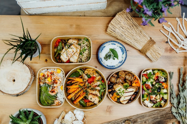 various healthy and vitamin rich dishes and food in an ecobox delivered by a delivery service