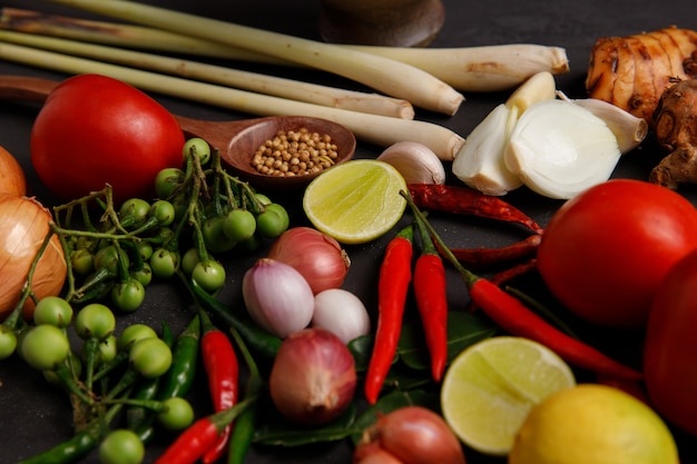 Various herbs, spices and Ingredients on dark