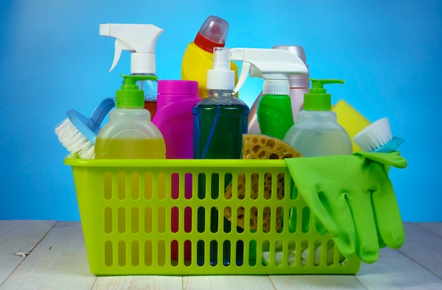 Various household chemicals on a blue background