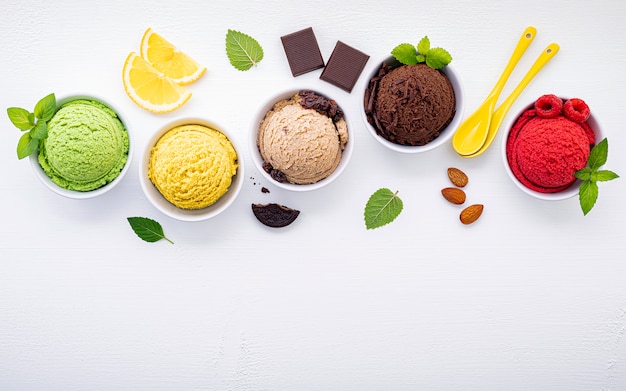 Various of ice cream flavor ball set up on white wooden background .