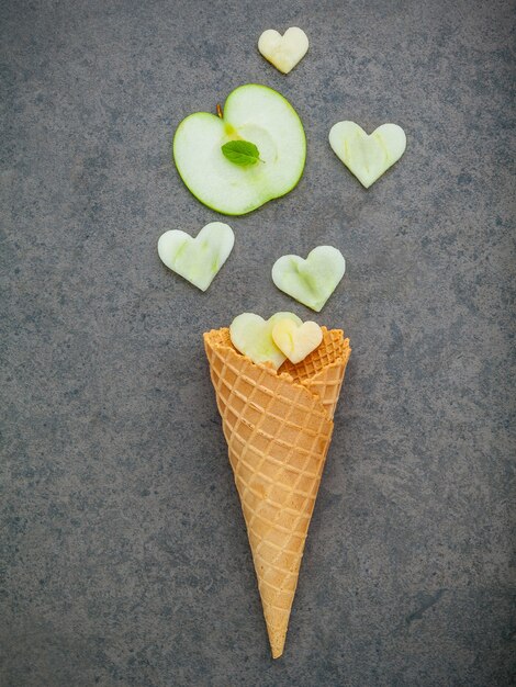 Various of ice cream flavor in cones setup on dark stone background . 