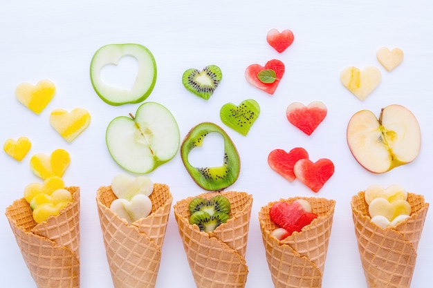 Photo various of ice cream flavor in cones setup on white background .