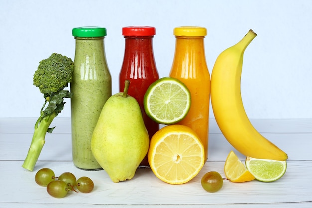 Various kind of smoothies or juices in glass bottles