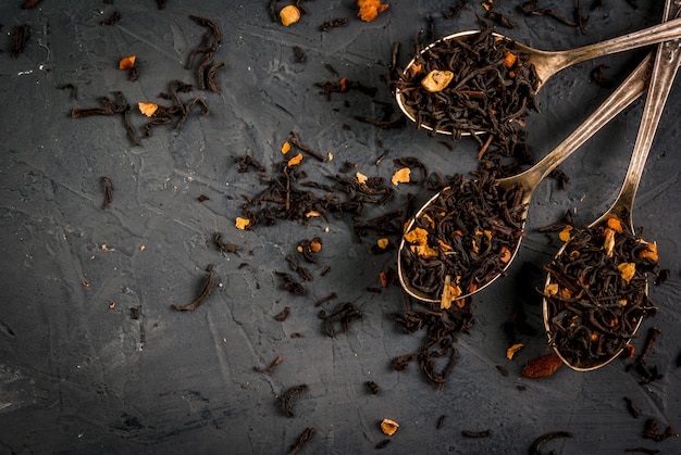 Various kinds of dry tea in spoons