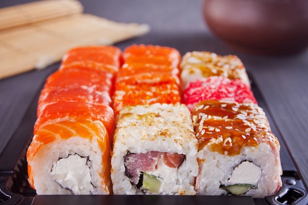 Various kinds of sushi served on a table