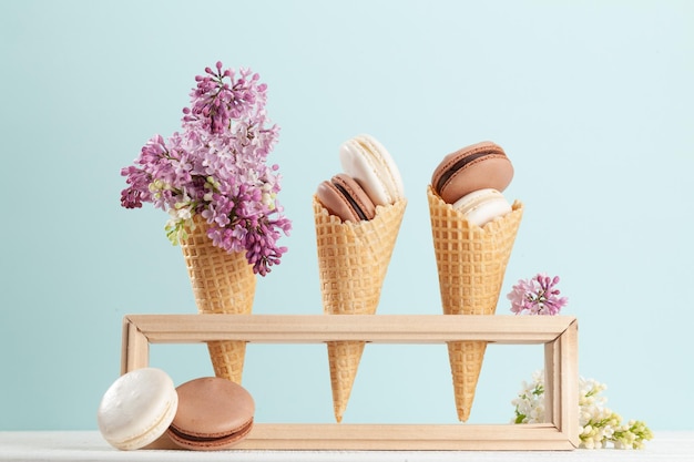 Various macaroon cookies in ice cream cones