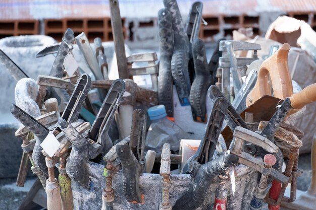 Various masonry and brickwork tools being used on a construction site