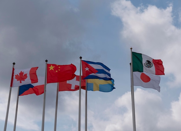 Various national flags countries under a blue sky