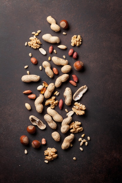 Various nuts on stone table