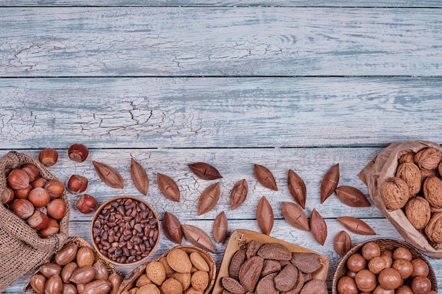 Various nuts in wooden bowls