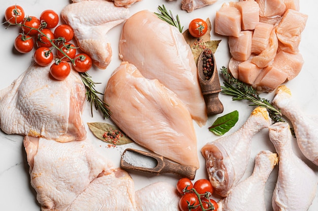 Photo various parts of chicken cut up and ready for cooking