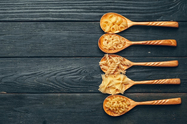 Various pasta on spoons