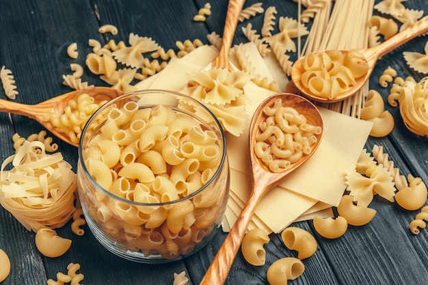 Various pasta on spoons