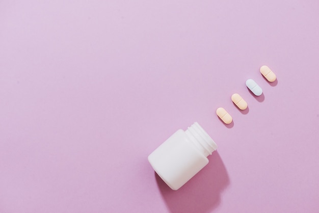 Various pharmaceuticals. All on pink background.