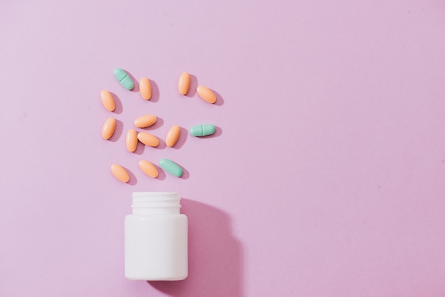 Various pharmaceuticals. All on pink background.