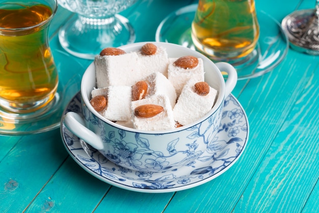 various pieces of turkish delight lokum and black tea