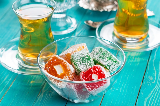 various pieces of turkish delight lokum and black tea