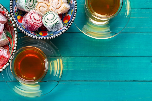 Various pieces of turkish delight lokum and black tea