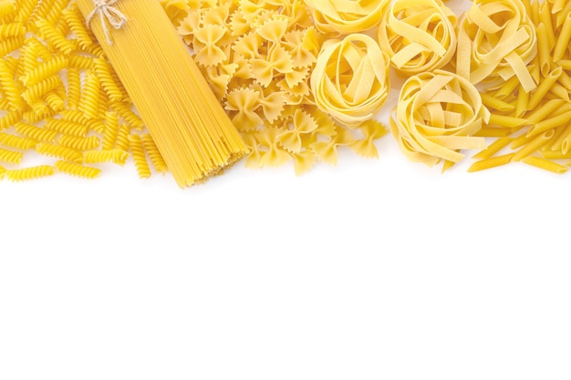 Various raw italian pasta on white