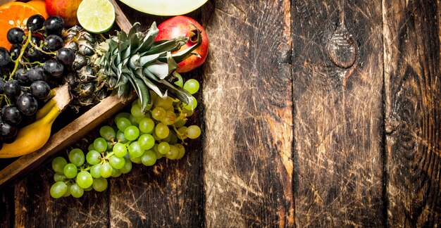 Various ripe fruits in a wooden box.