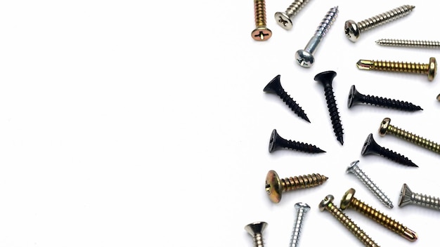 Various screws on a white background tapping screws made od steel metal screw iron screw