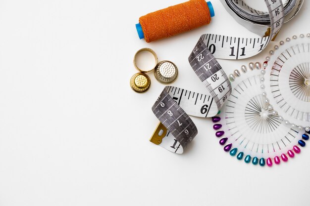 Various sewing accessories isolated on white surface