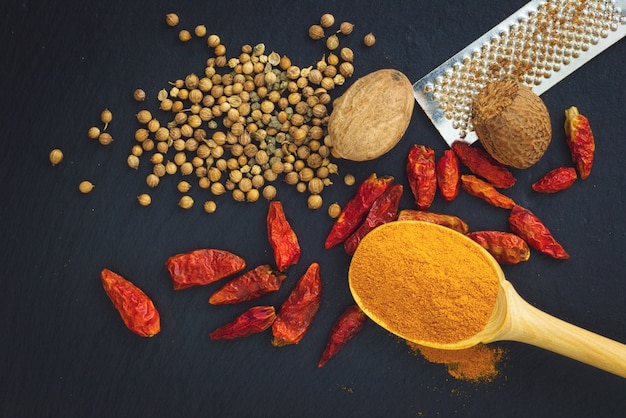 Various Spices on black slate board