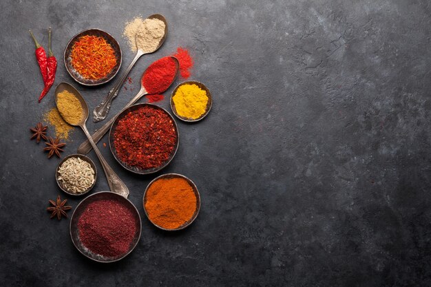 Various spices in bowls and spoons