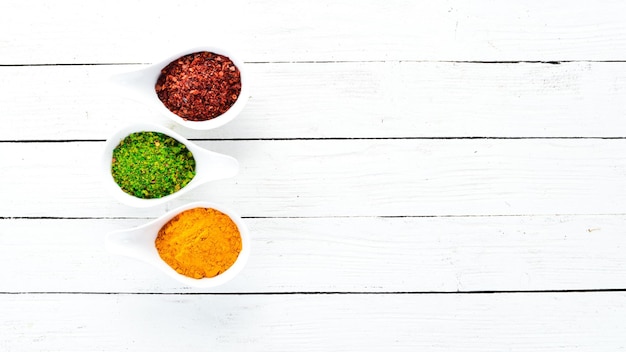 Various spices in a bowls on white background Indian spices Top view