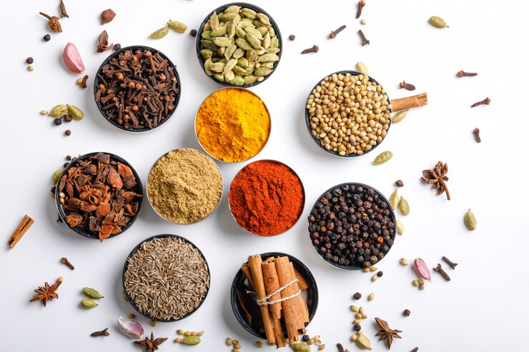 Photo various spices in a bowls on white. top view with copy space.
