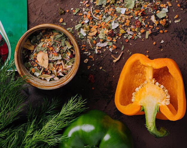 Various spices for dish with peppers top view