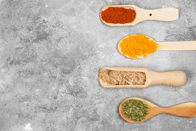Various spices on a gray background. Top view, copy space. Food background