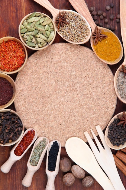 Various spices and herbs with empty board