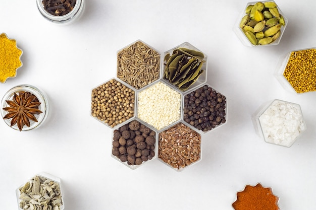 Various spices in hexagonal jars