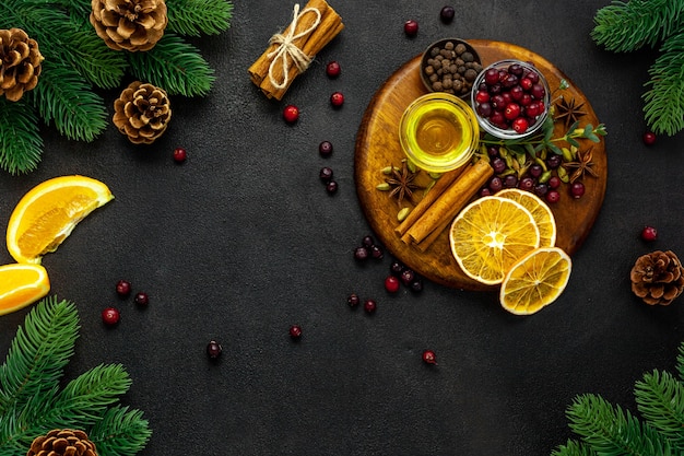 Various spices for preparing mulled wine hot drink Cinnamon, honey, spices and cranberries