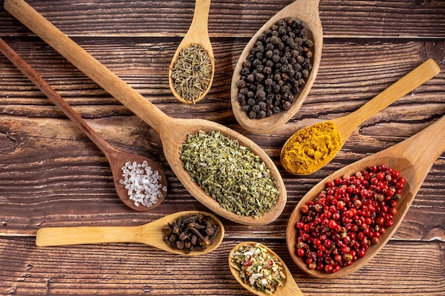 Various spices and seasonings in wooden spoons