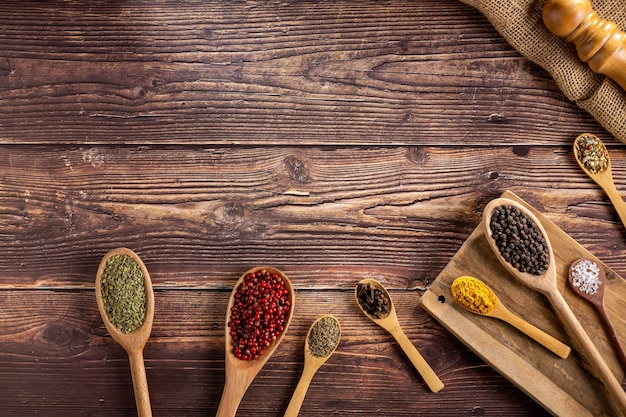 Various spices and seasonings in wooden spoons