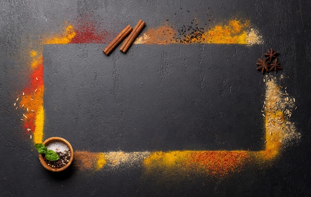 Various spices on stone table