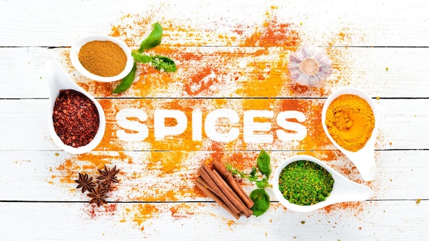 Various spices on white background The word spice Indian spices Top view