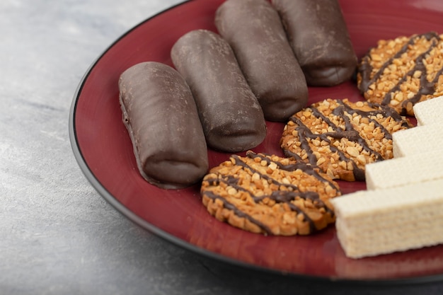 Various sweet snacks placed in a bowl .